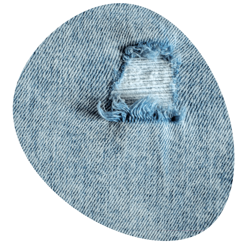 a hole in the back of a pair of jeans, photo by Roberto Sorin